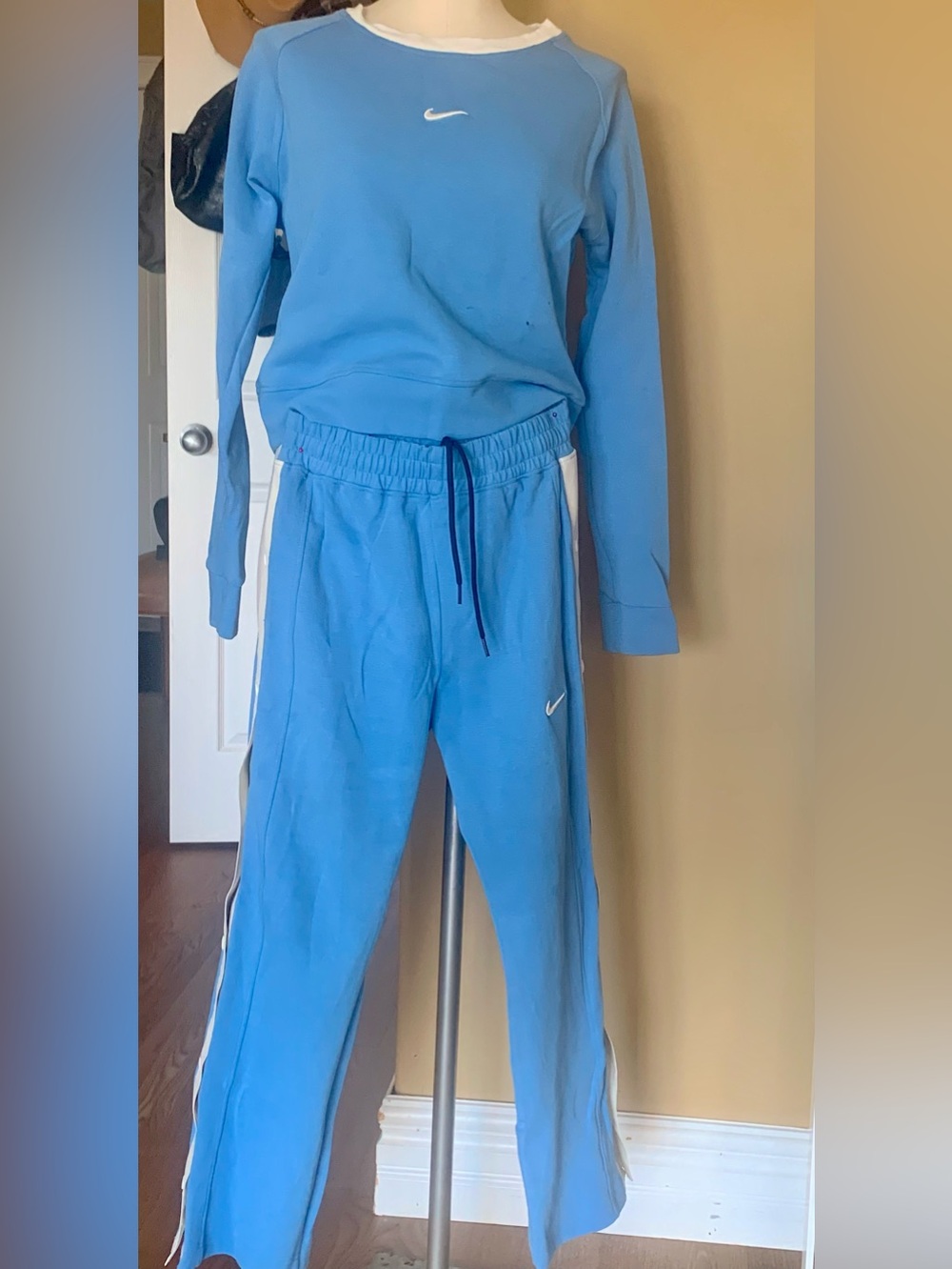 Nike Light Blue Women's Track Pants with White Side Stripes and top set.